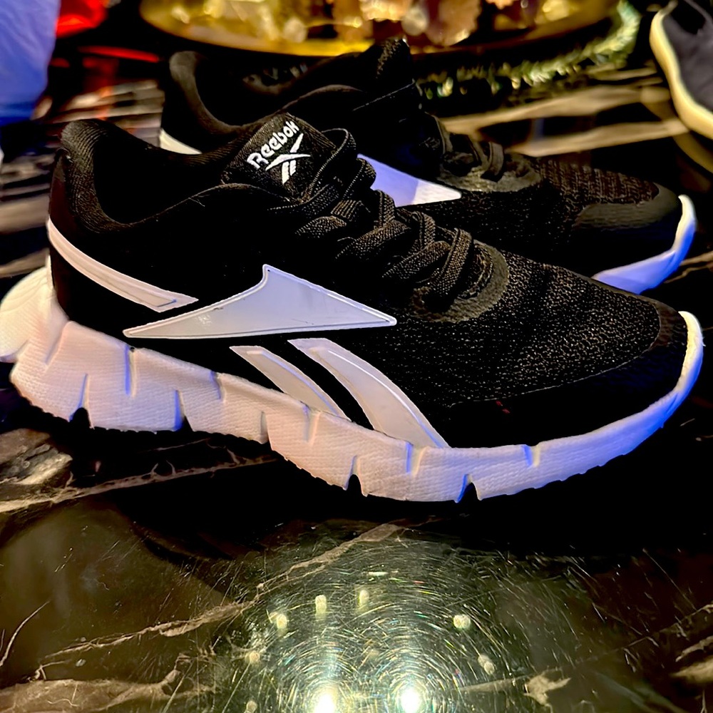 Kids Reebok size 13 black and white. Worn once inside. Never outside.